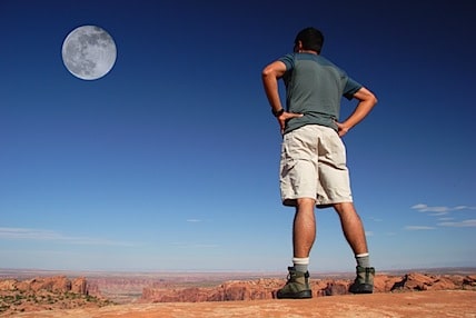 a man staring up at the moon