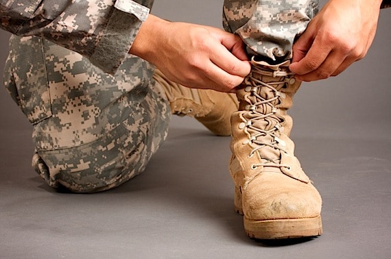 A soldier Lacing Up His Boots - Photo courtesy of ©iStockphoto.com/carlofranco, Image #8614676